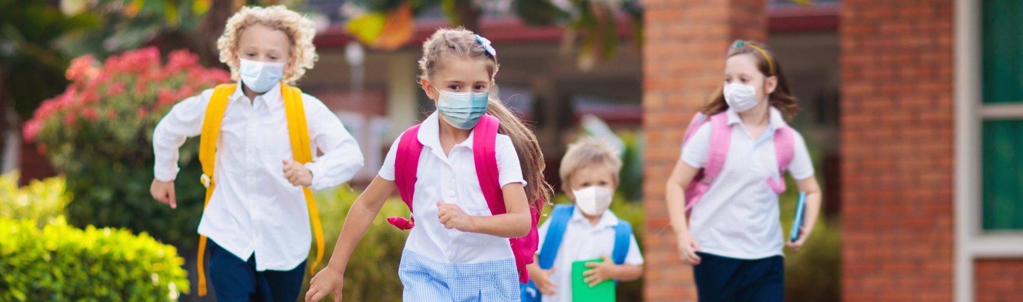 Image of children running away from school; courtesy of Shutterstock. Image of children running away from school; courtesy of Shutterstock.